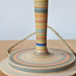 detail of striped wooden table light